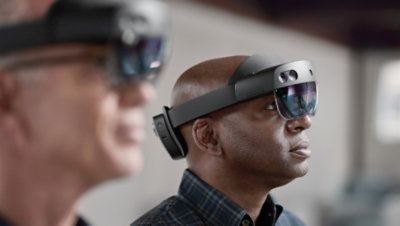 A woman wearing a Microsoft HoloLens glass