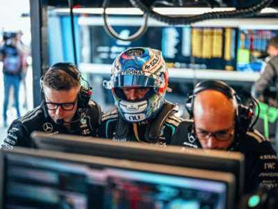 Three people looking at screen