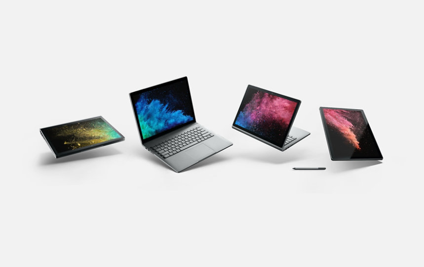 4 つの異なるモードで表示されている Surface Book と、Surface ペン