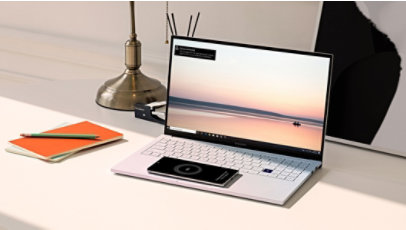 A smart phone charging on the Ion trackpad with Wireless PowerShare.