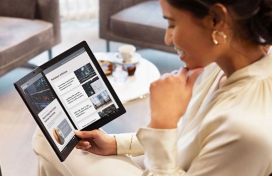 Woman reading on Lenovo Thinkpad X1 Fold.