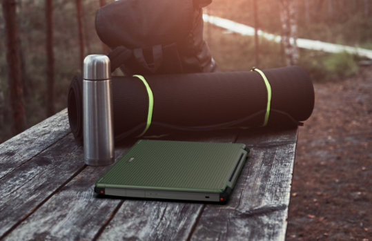 Acer Enduro Urban N 3 on outdoor table with camping equipment.
