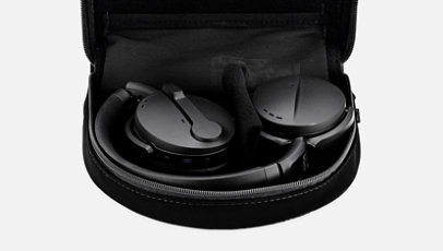 Sennheiser Adapt 560 headset in black folded up in case.