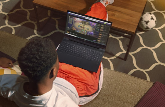 A person using the HP Victus laptop to watch a live video game stream on Twitch.