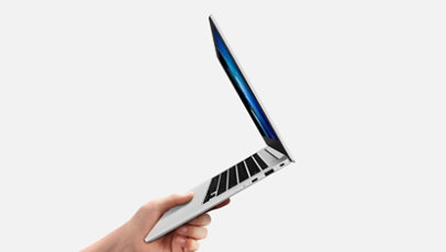 A single hand holding the Galaxy Book Go showing how lightweight it is.