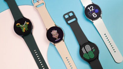 Multiple Samsung Galaxy Watch 4 in various colours sitting on a pink and blue decorative background. 