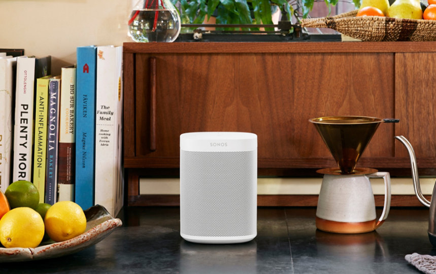 Sonos One in White in a dining room setting.