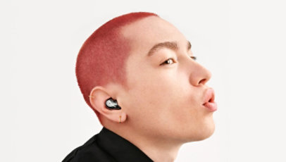 A person wearing the Samsung Galaxy Buds.