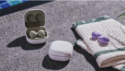 A pair of the Olive Samsung Galaxy Buds 2 next to a pair of the Lavender Samsung Galaxy Buds 2.