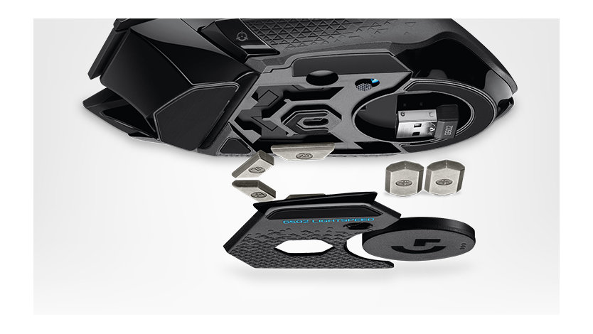Logitech wireless mouse deconstructed with view of charging base.