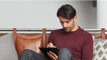 A person checking frequently asked questions on a Surface device.