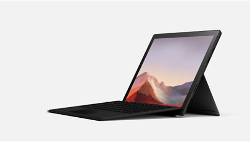 A platinum Surface Pro 7 Plus with black keyboard.