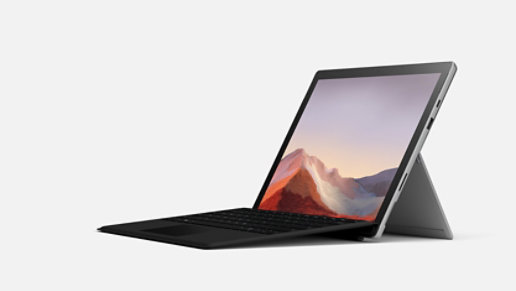 A platinum Surface Pro 7 Plus with black keyboard.