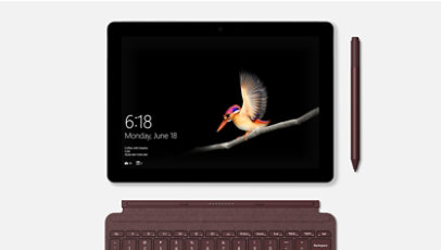 Un primer plano de una Surface Go con pantalla inteligente separada de la funda con teclado con un lápiz delgado cerca.