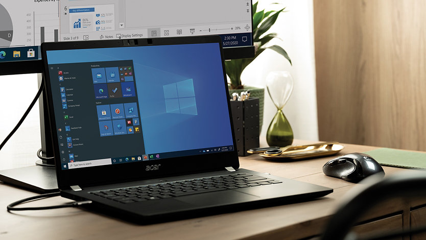 A laptop on a desk connects to Windows Server.