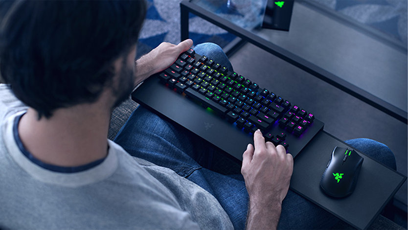 A person using the Razer Turret for gaming.