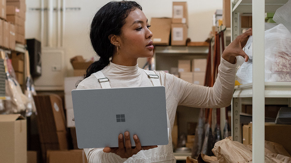 Woman holding Surface Laptop 3.