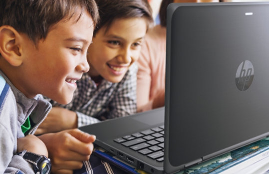 Two children sitting around the HP Probook x360 11 G5 laptop screen.