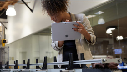 A person using a Surface Pro 7 to check a manufacturing process
