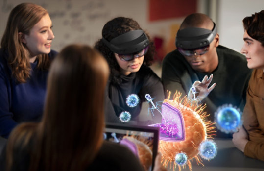 Coworkers use HoloLens devices to observe the human brain.