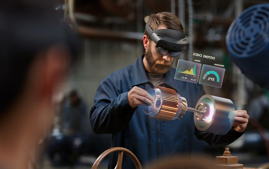 A person uses a HoloLens device to perform a system check at work.