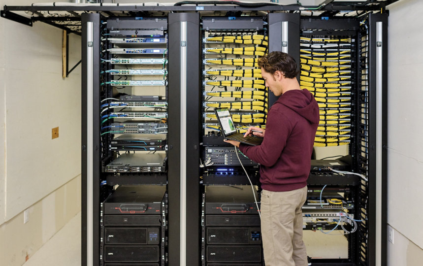 A person working in a server room.