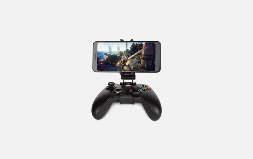MOGA Mobile Gaming Clip with phone attached and playing Sea of Thieves.