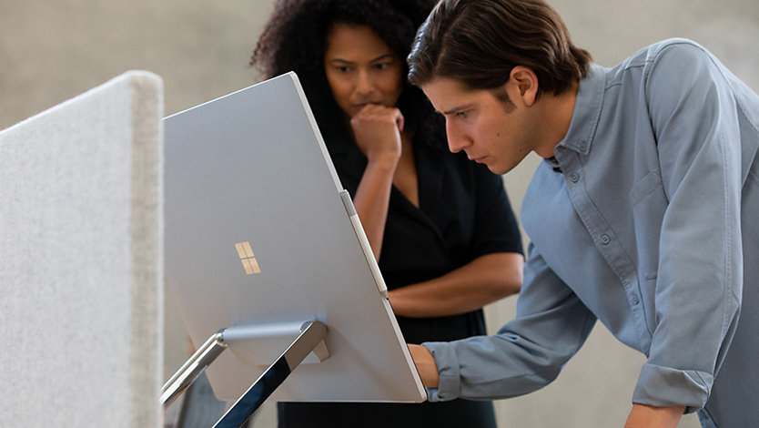 2 people collaborating with Surface Studio 2