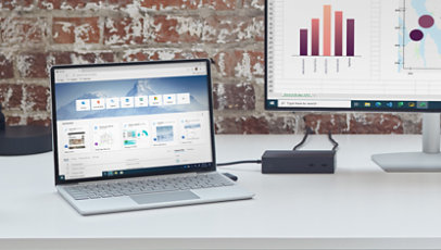 Surface Laptop Go připojený k doku Surface a externímu monitoru