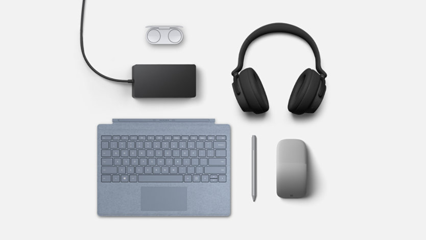 Surface Type Cover in ice blue, Pen and Arc Mouse in platinum, Headphones in matte black, Earbuds in glacier and Dock 2. 