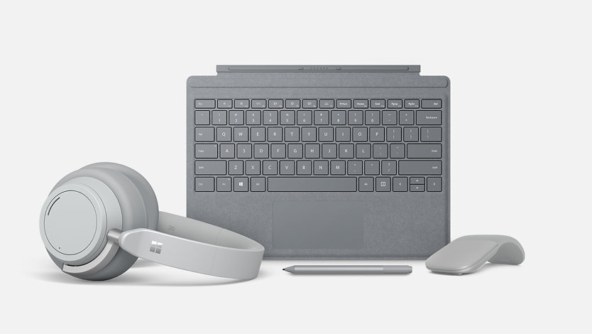 Surface for Business accessories including Surface Headphones, Surface Pen, Surface Mouse, and Surface Keyboard.