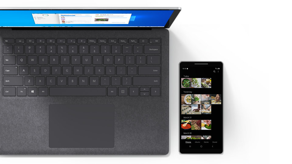 A Surface Laptop 3 next to a smartphone.