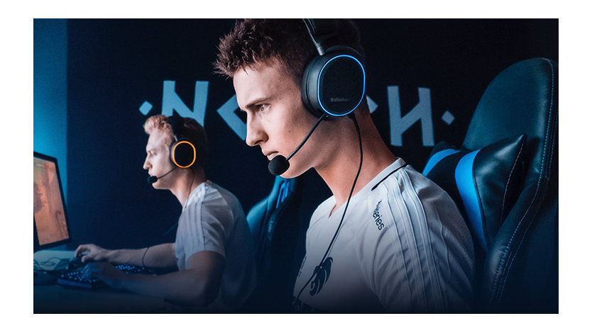 Two gamers using the Steel Series Arctic Pro PC Gaming Headset.