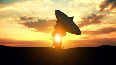 Military planes flying over military ships in the ocean