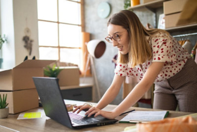 A person working on a laptop computer presumably enabling sales