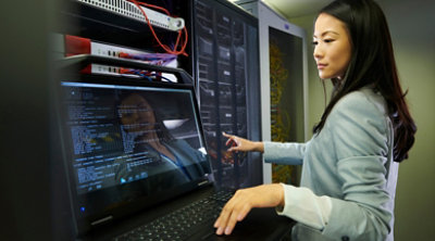 A lady is working on the computer