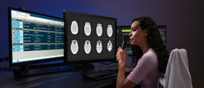 A woman looking at a computer screen.