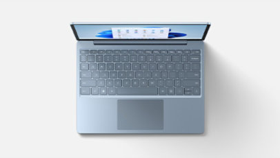 A top-down view of Surface Laptop Go 2 in Ice Blue features the keyboard.