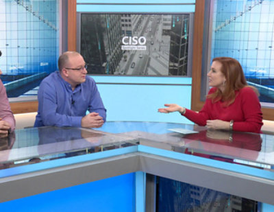 Theresa Payton, Mark Simos, and David Weston seated at a counter in a professional studio setting with CISO Spotlight Series and CISO city image in background.