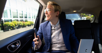 Business professional, working on the go using multiple devices.