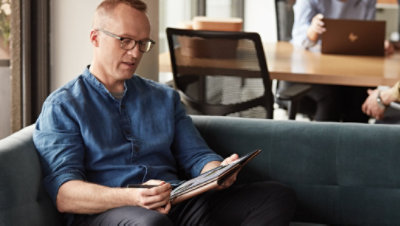 A person using a Surface tablet outdoors