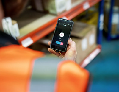 A close-up of a person holding a phone.
