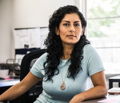 A person sitting at their desk.