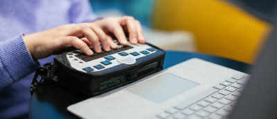 A person typing on a keyboard.