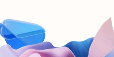 A blue container with pink and blue wavy fabric.