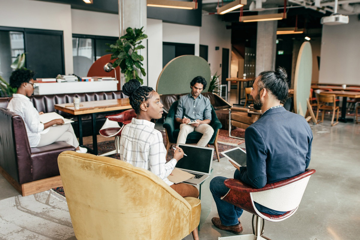 Group sitting in a causal work area.