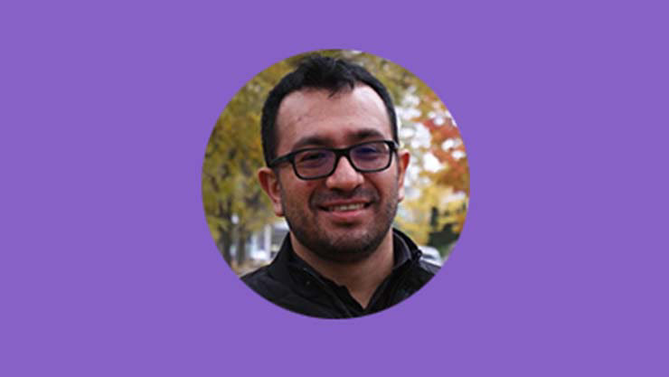 Juan Olarte's headshot on a purple background