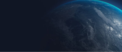 Partial view of Earth from space with a visible blue atmospheric glow.