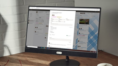 Ein Desktopmonitor, auf dem eine neue Planner-Aufgabe von einer Person erstellt wird