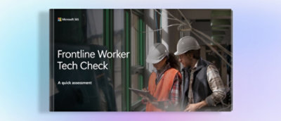 A group of people wearing hard hats, including a woman in a white hard hat and orange vest.